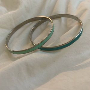 Layered blue and silver bracelets
